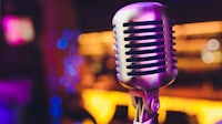 a microphone in front of a colorful background